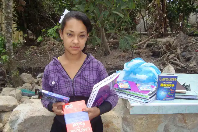 Alejandra with school books