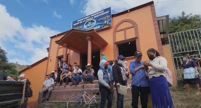 people gathered in front of church at Jocomico