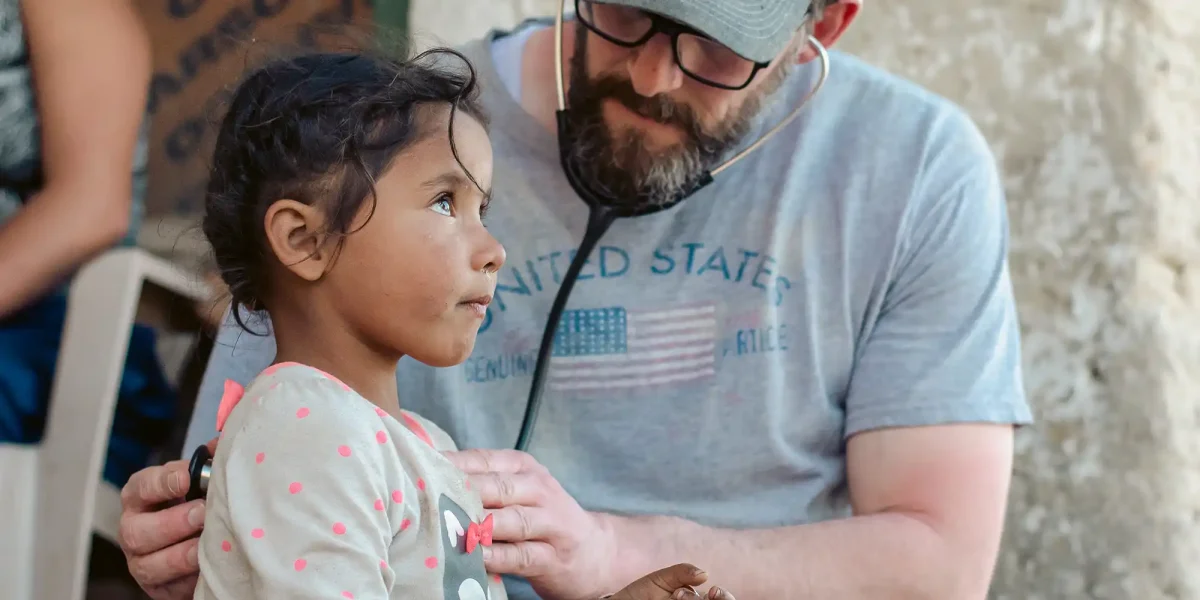 medical missionary examining child