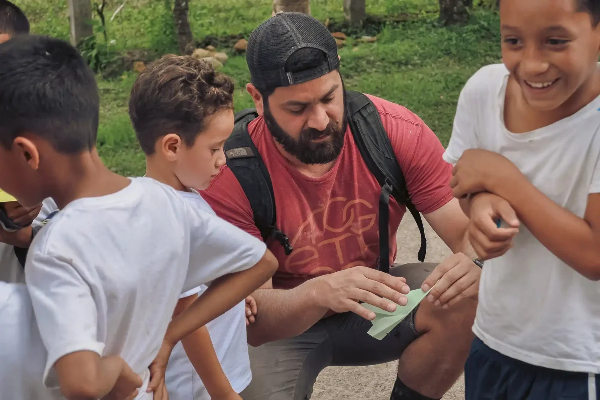 Mission team worker teaching children