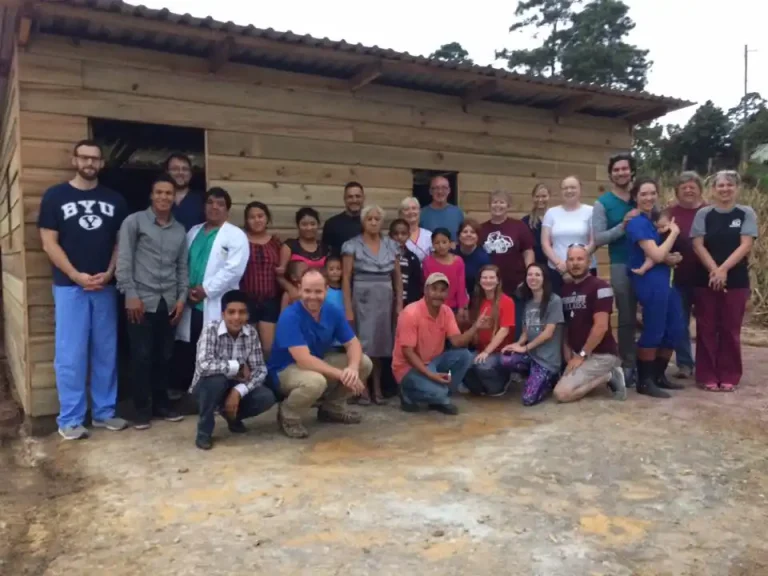 construction team members outside new house