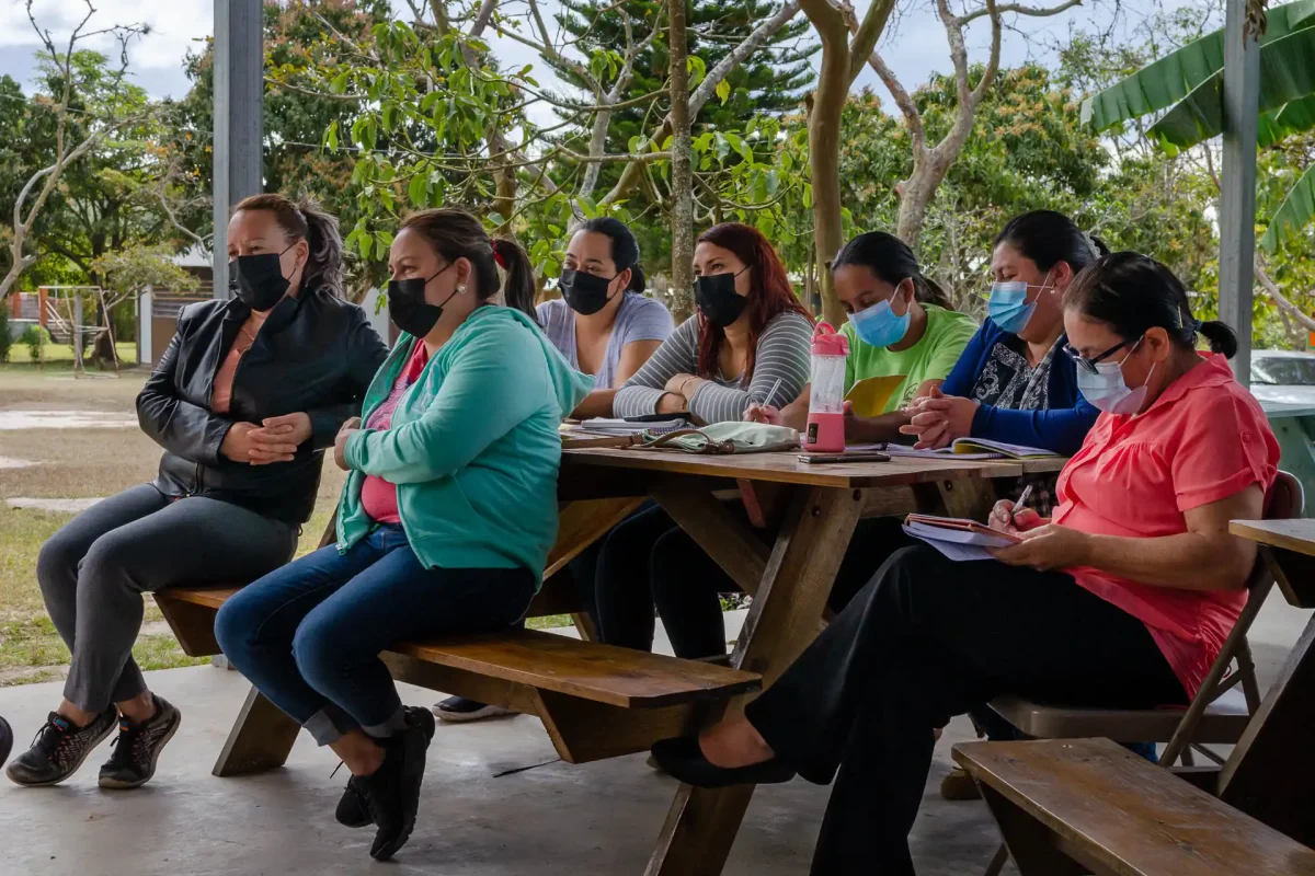 Group of mothers listening and taking notes