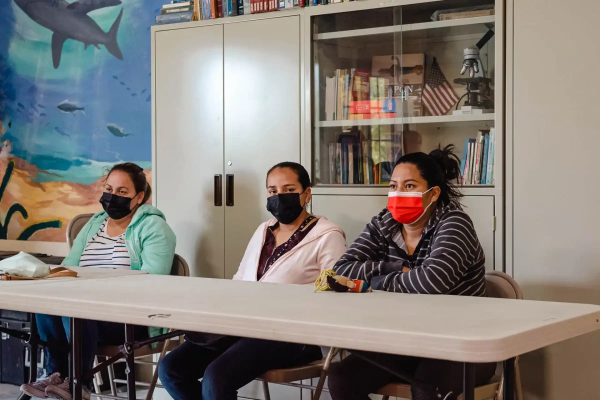 3 women sitting in classroom