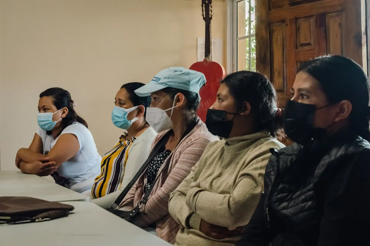 group of parents listening to someone talking