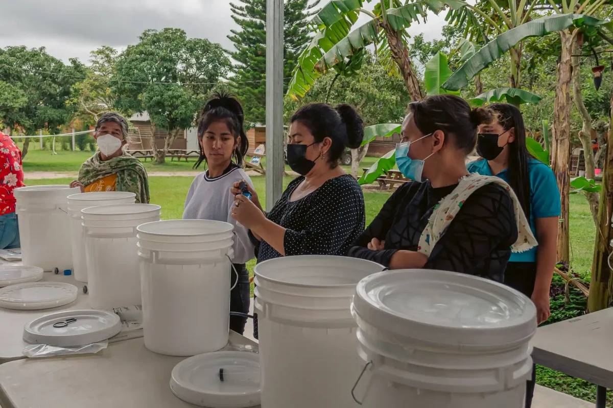 4 women practicing with clean water kits