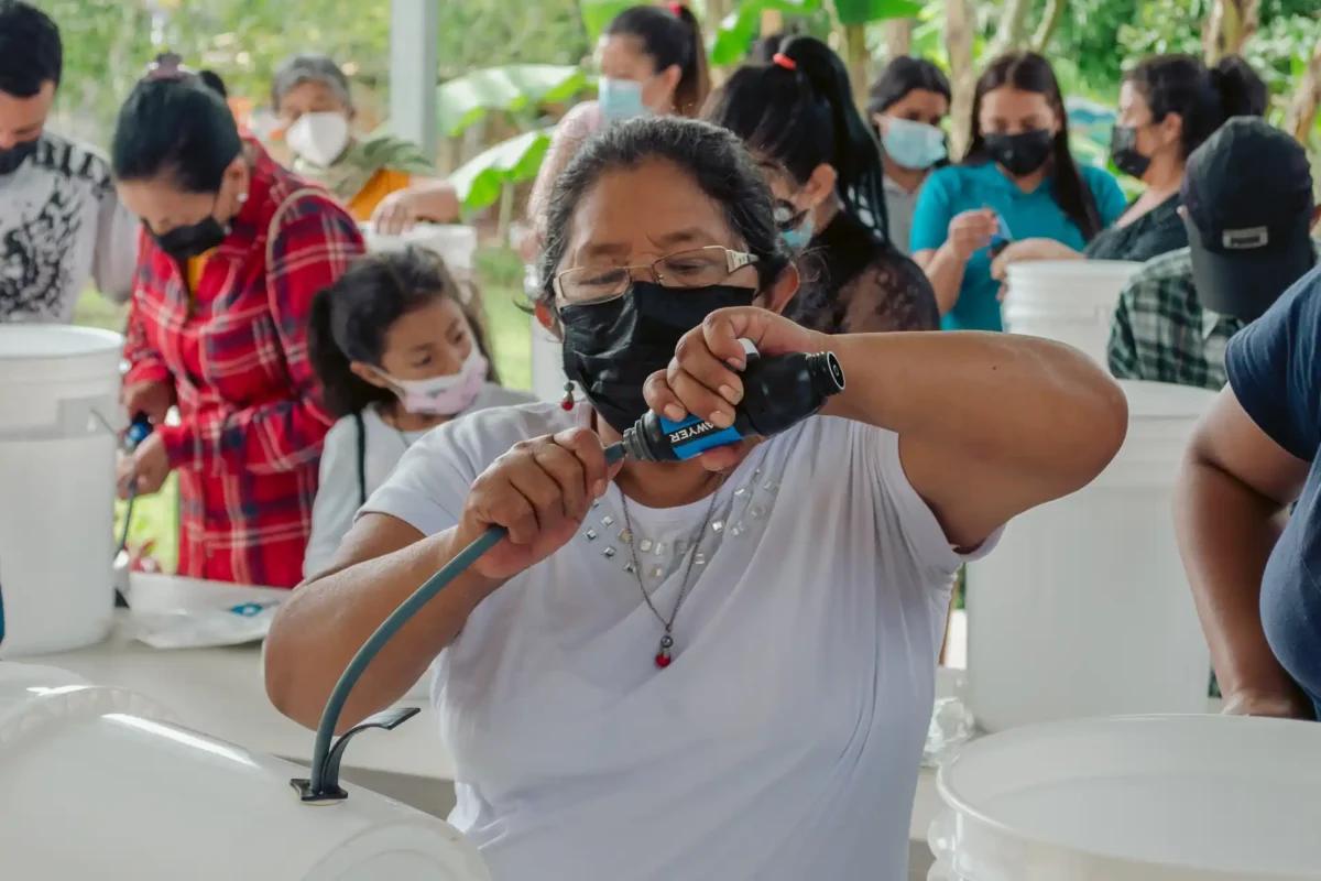 woman putting together clean water kit