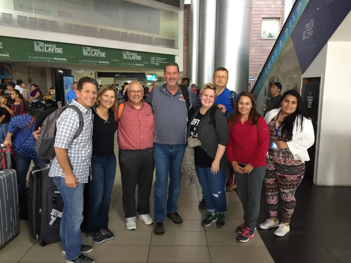 Bill Roy and mission team members at airport