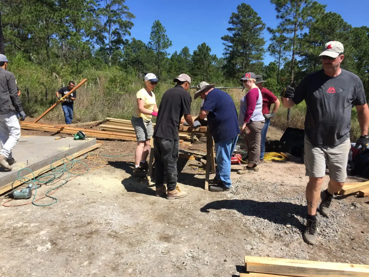 mission team members building a house