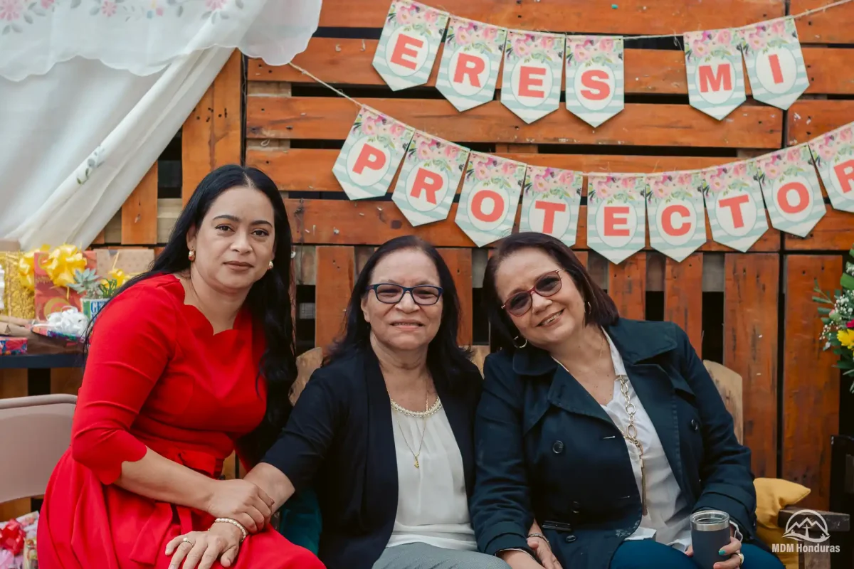 3 women posing for photo