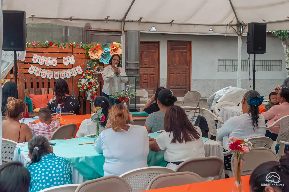 Woman speaking to female audience