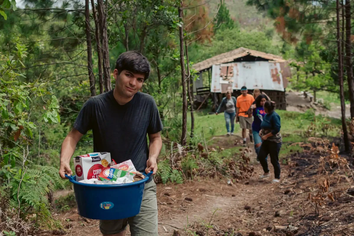 man carrying nutrition basket