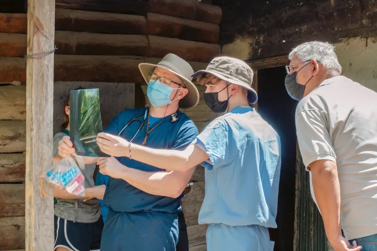 medical team members reviewing X-ray